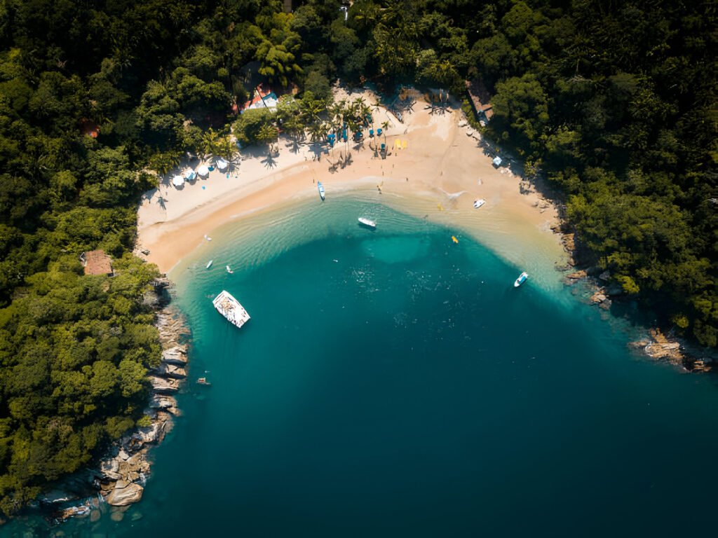 Digital Nomads in Mexico collaborating in a vibrant co-working space with colorful décor and traditional Mexican artwork.