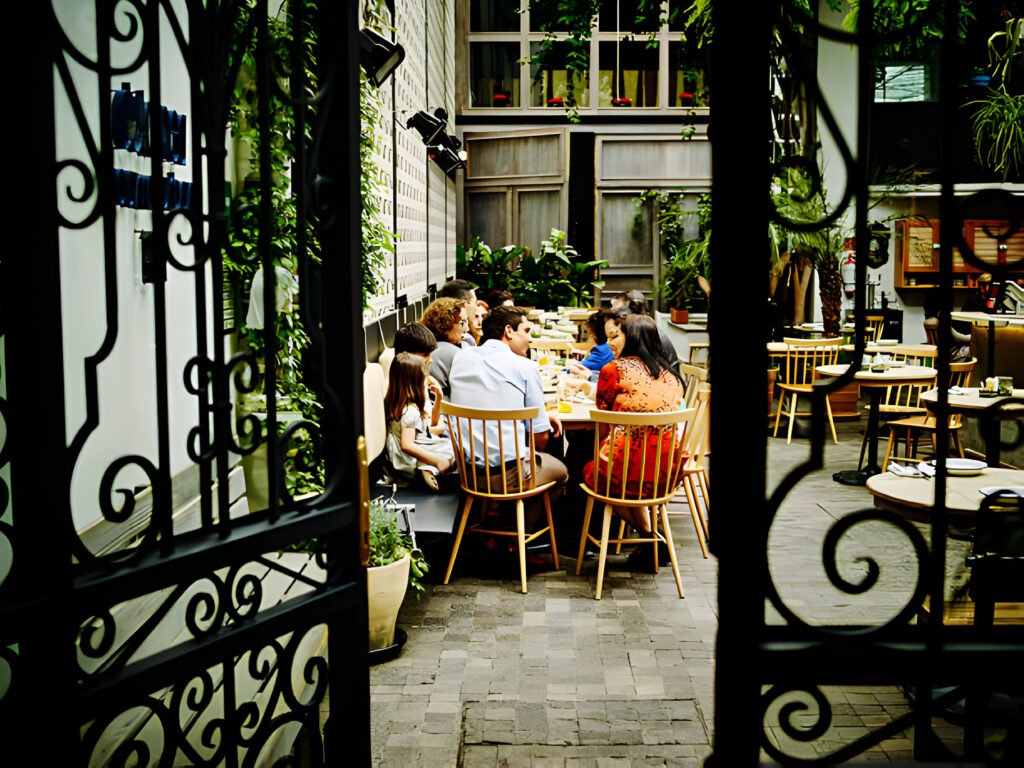 Digital Nomads in Mexico collaborating in a vibrant co-working space with colorful décor and traditional Mexican artwork.