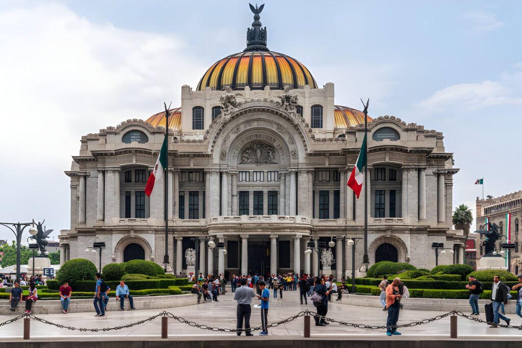 Digital Nomads in Mexico collaborating in a vibrant co-working space with colorful décor and traditional Mexican artwork.