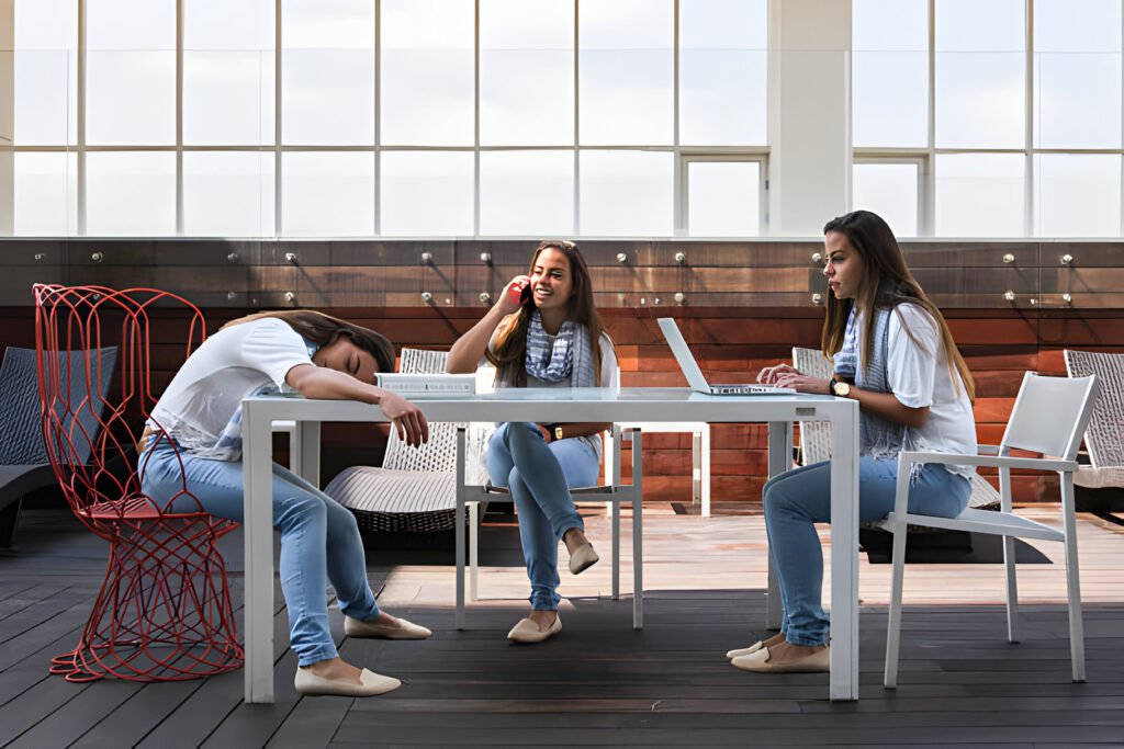 Digital Nomads in Mexico collaborating in a vibrant co-working space with colorful décor and traditional Mexican artwork.